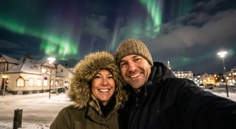Before: a couple’s selfie under the northern lights in a snowy town