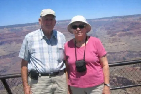 Before: an older couple at a canyon overlook