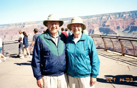 Before: an older couple in sun hats at a canyon overlook, with a date stamp in the corner