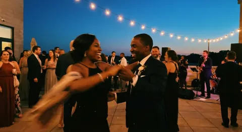 Before: an evening party under string lights, with a woman dancing beside a man in a tuxedo